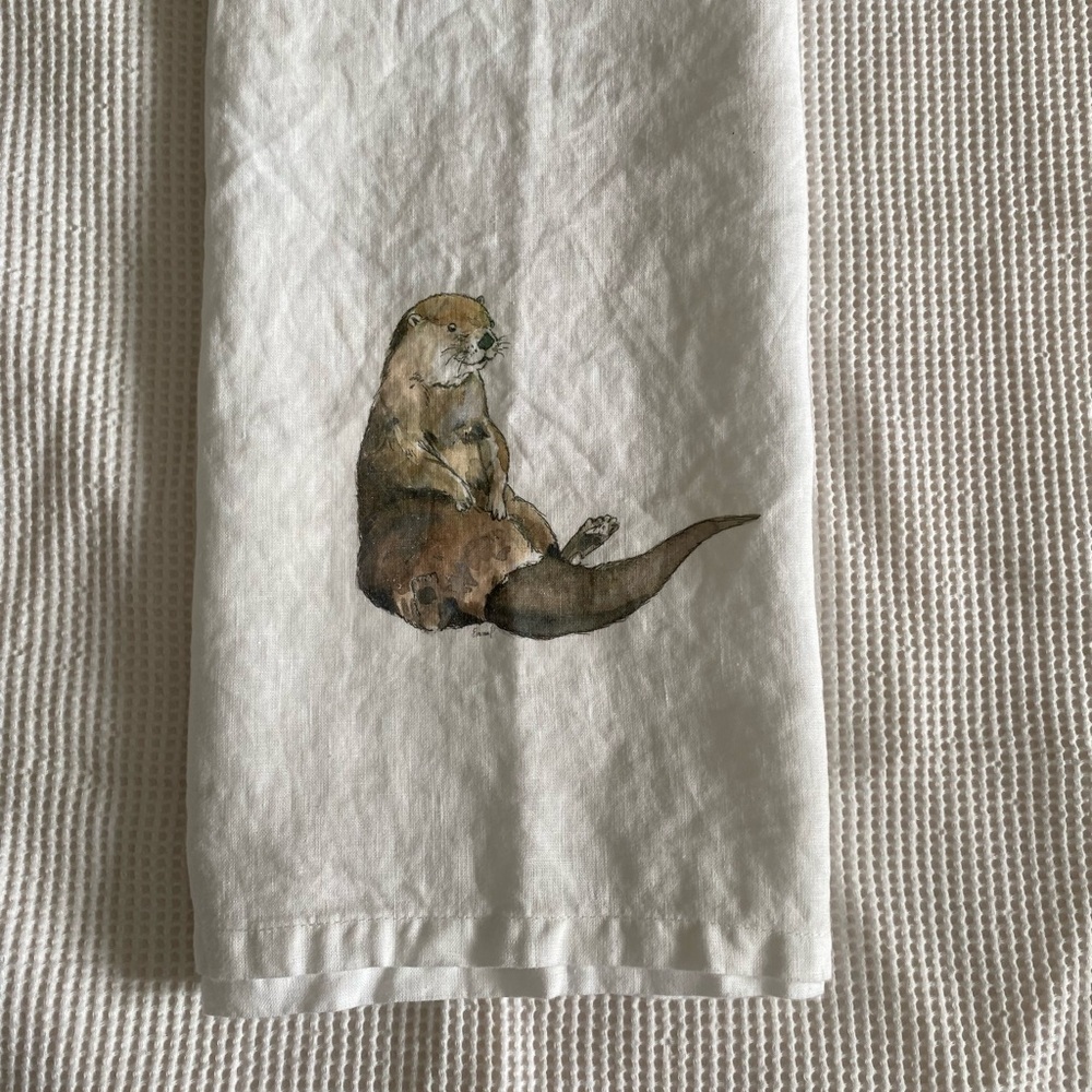 White cotton dish towel/tea towel with River Otter design.